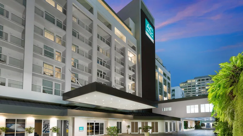 AC Hotel San Juan Condado exterior and entrance at dusk