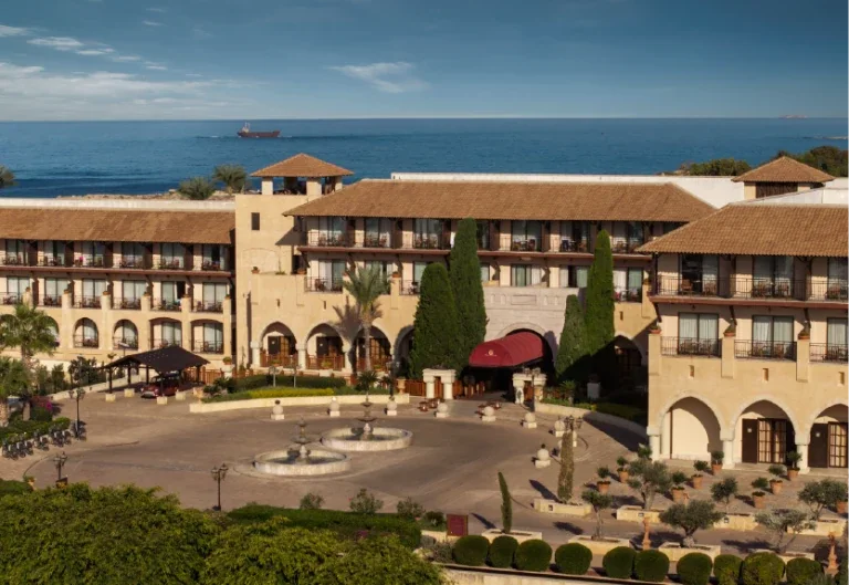 Elysium hotel courtyard, facade and Mediterranean sea in Paphos