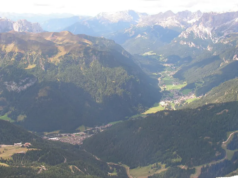 Fassa Valley seen from the Sass Pordoi. The First village on the left is Canazei.