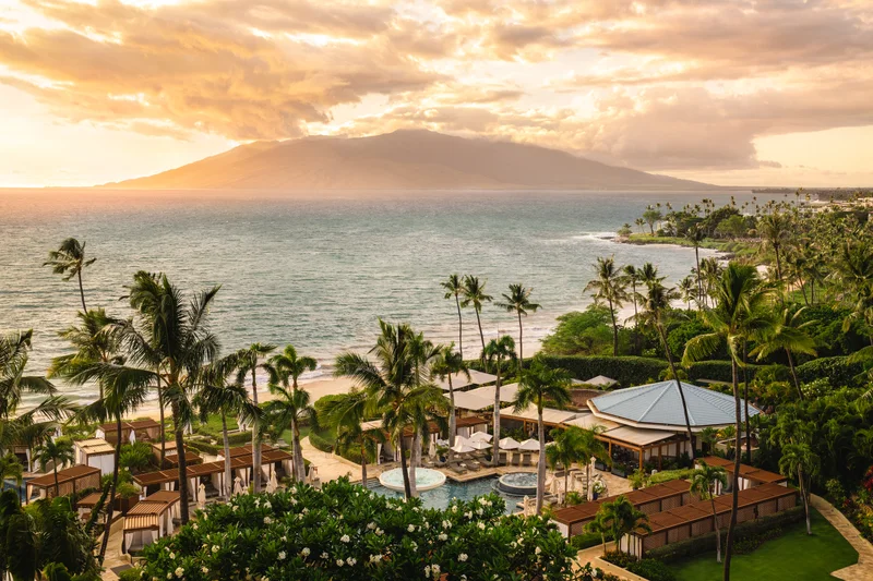 Four Seasons Resort Maui gardens, pool and Wailea coastline at sunset