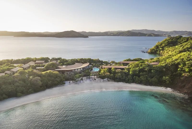 Four Seasons Resort Peninsula Papagayo overlooking a sheltered bay and forested coastline