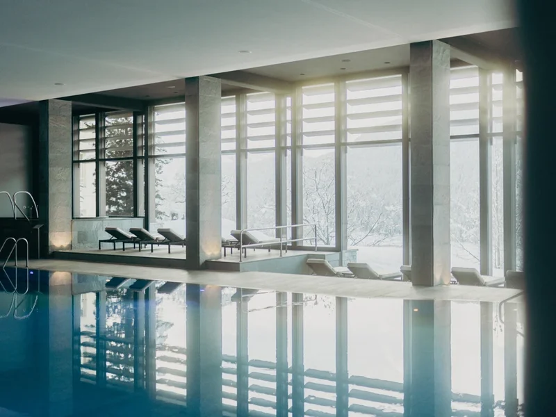 Indoor pool and alpine-facing windows at Kulm Hotel St. Moritz