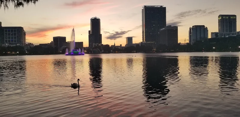 Lake Eola and Orlando skyline at sunset