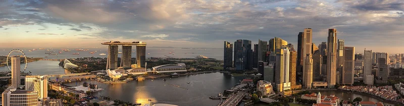 Marina Bay, Financial District and Singapore River in warm evening light