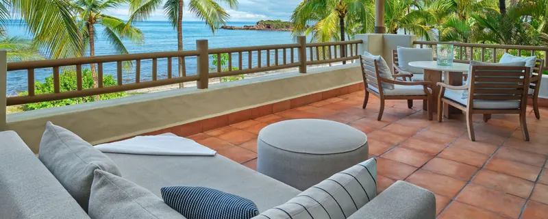 Oceanfront patio with shaded seating area