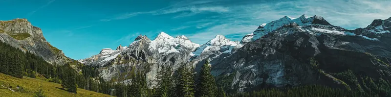 Oeschinensee at Kandersteg — turquoise lake and green summer Alpine scenery