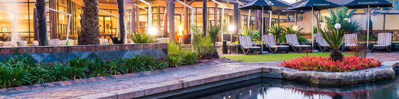 Pool and gardens at aha Kopanong Hotel in Benoni, greater Johannesburg