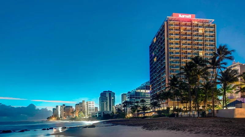 San Juan Marriott Resort and Stellaris Casino overlooking the beach at dusk